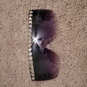 Sunglasses bedazzled green frames.